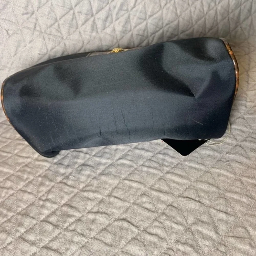 𝅺5/ $25 Cosmetic World black makeup bag with animal print